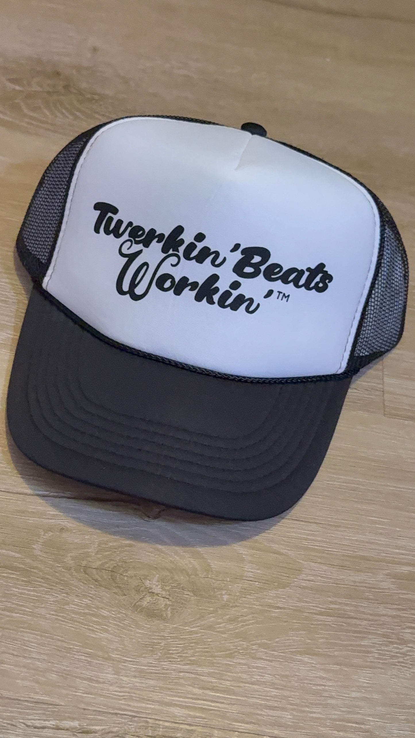 White and black hat with black Twerkin’ Beats Workin’ logo