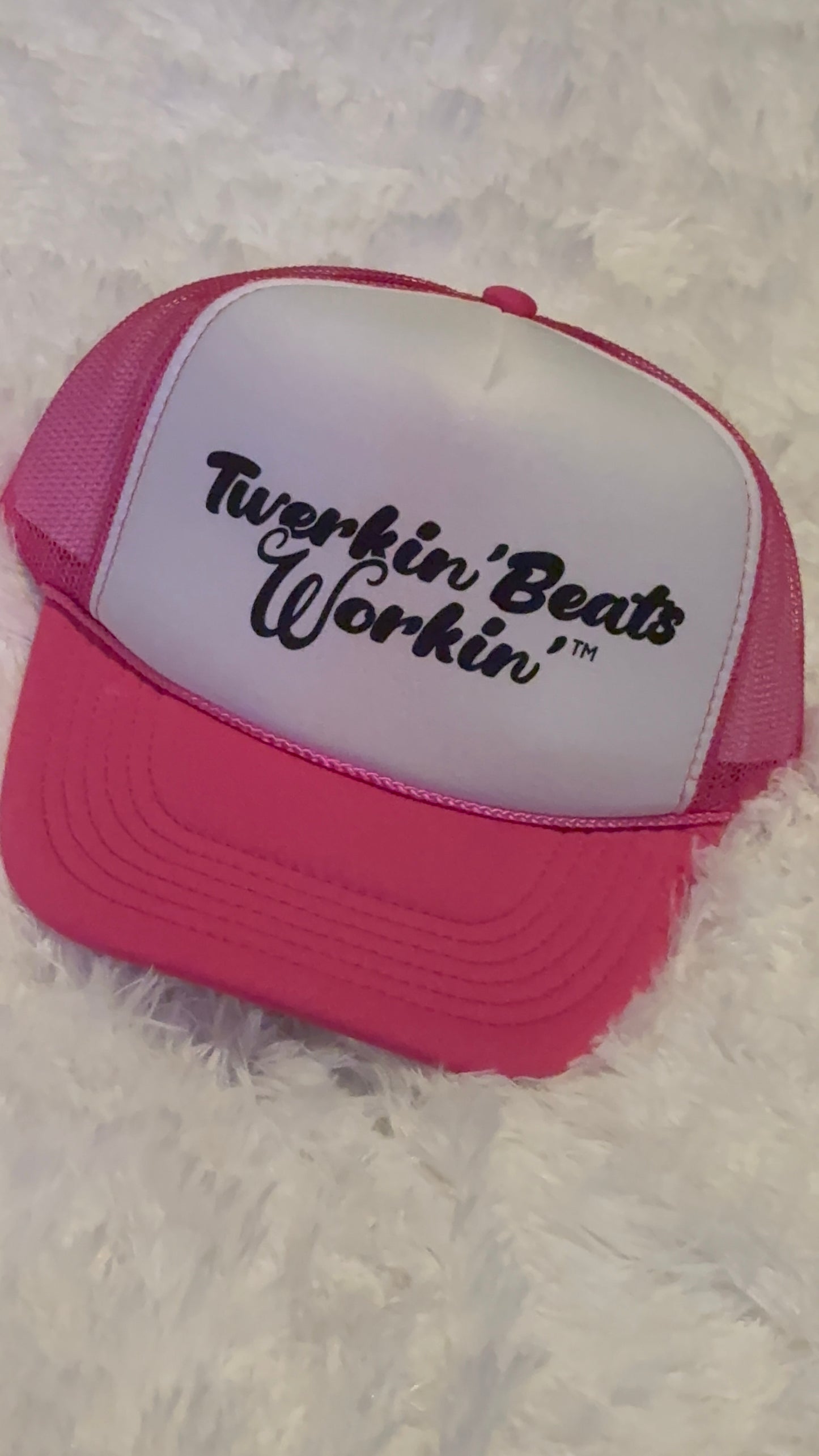 Pink and white with regular Twerkin’ Beats Workin’ in black logo