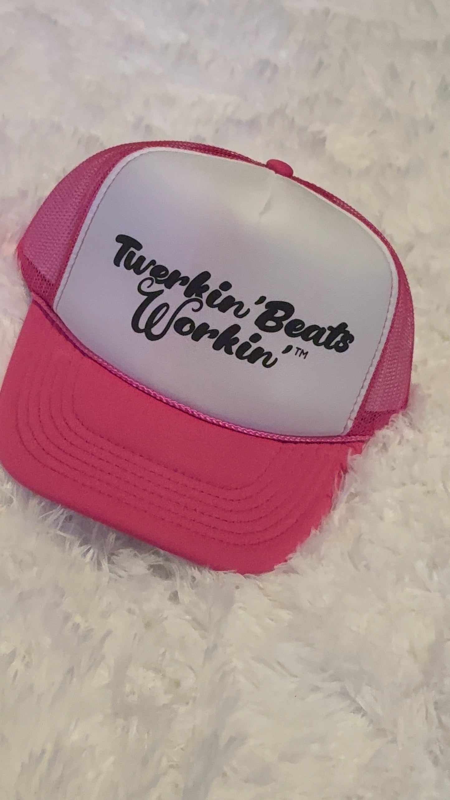 Pink and white with regular Twerkin’ Beats Workin’ in black logo