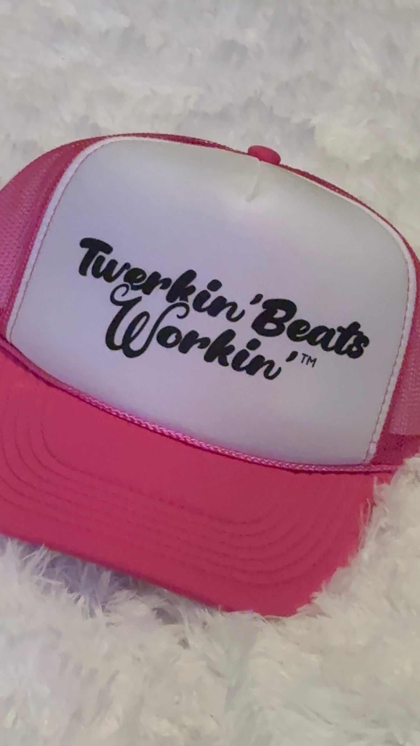 Pink and white with regular Twerkin’ Beats Workin’ in black logo