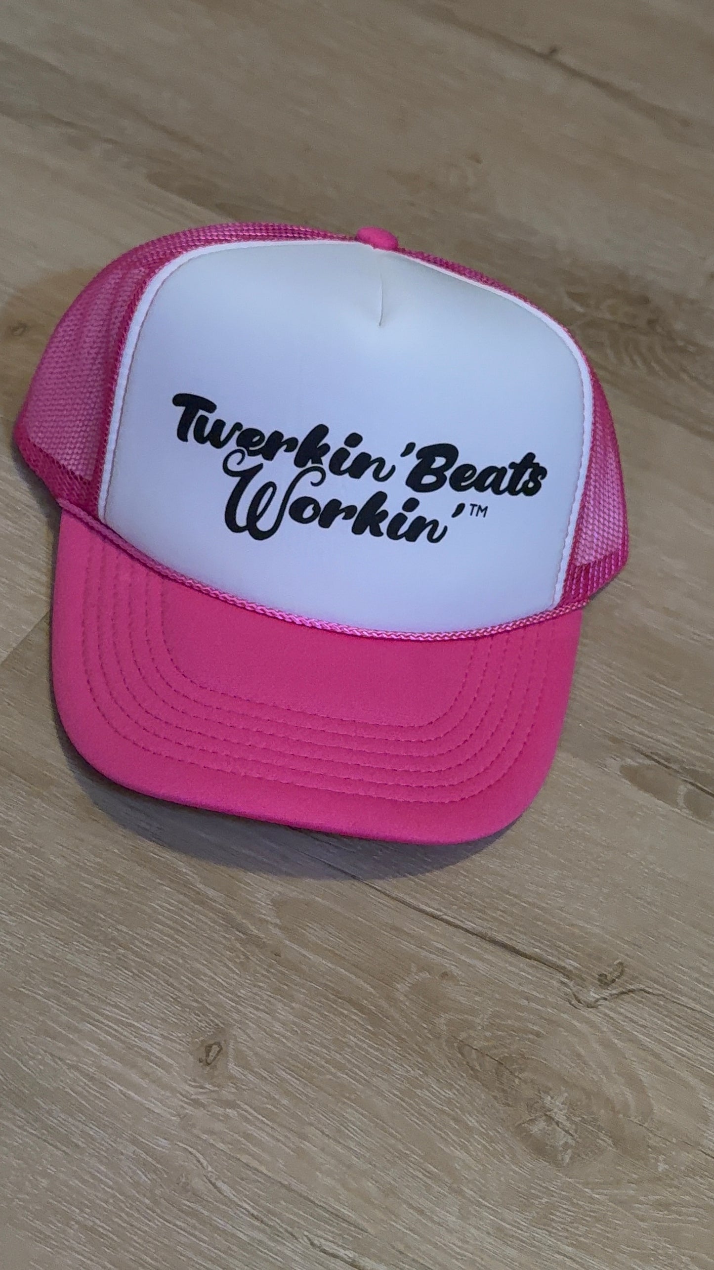 Pink and white with regular Twerkin’ Beats Workin’ in black logo