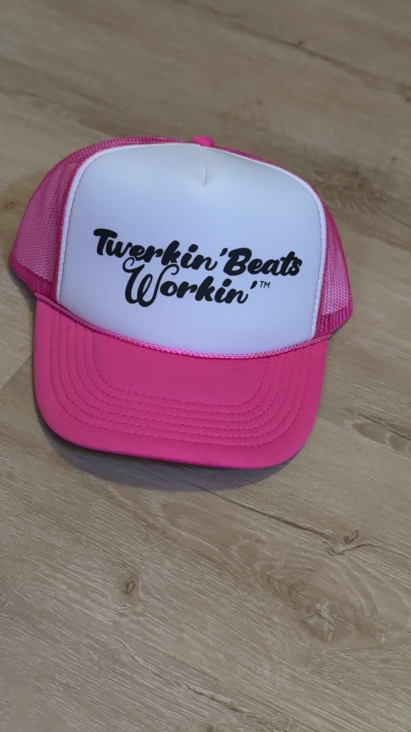 Pink and white with regular Twerkin’ Beats Workin’ in black logo
