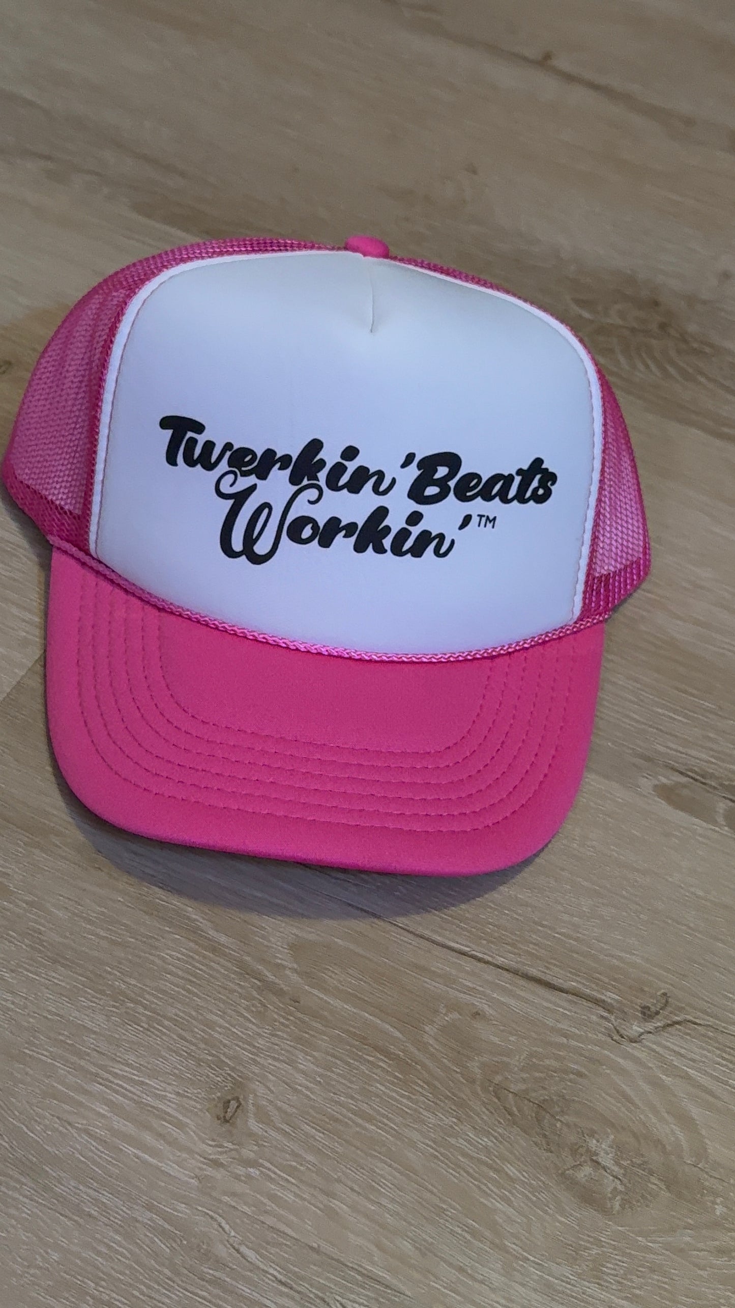 Pink and white with regular Twerkin’ Beats Workin’ in black logo