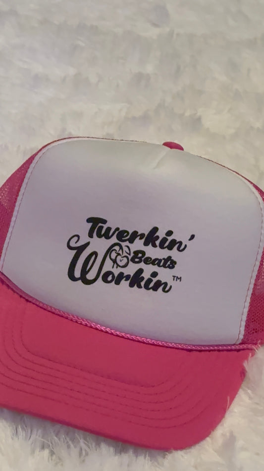 Pink and white hat with Twerkin’ Beats workin’ peach design in black