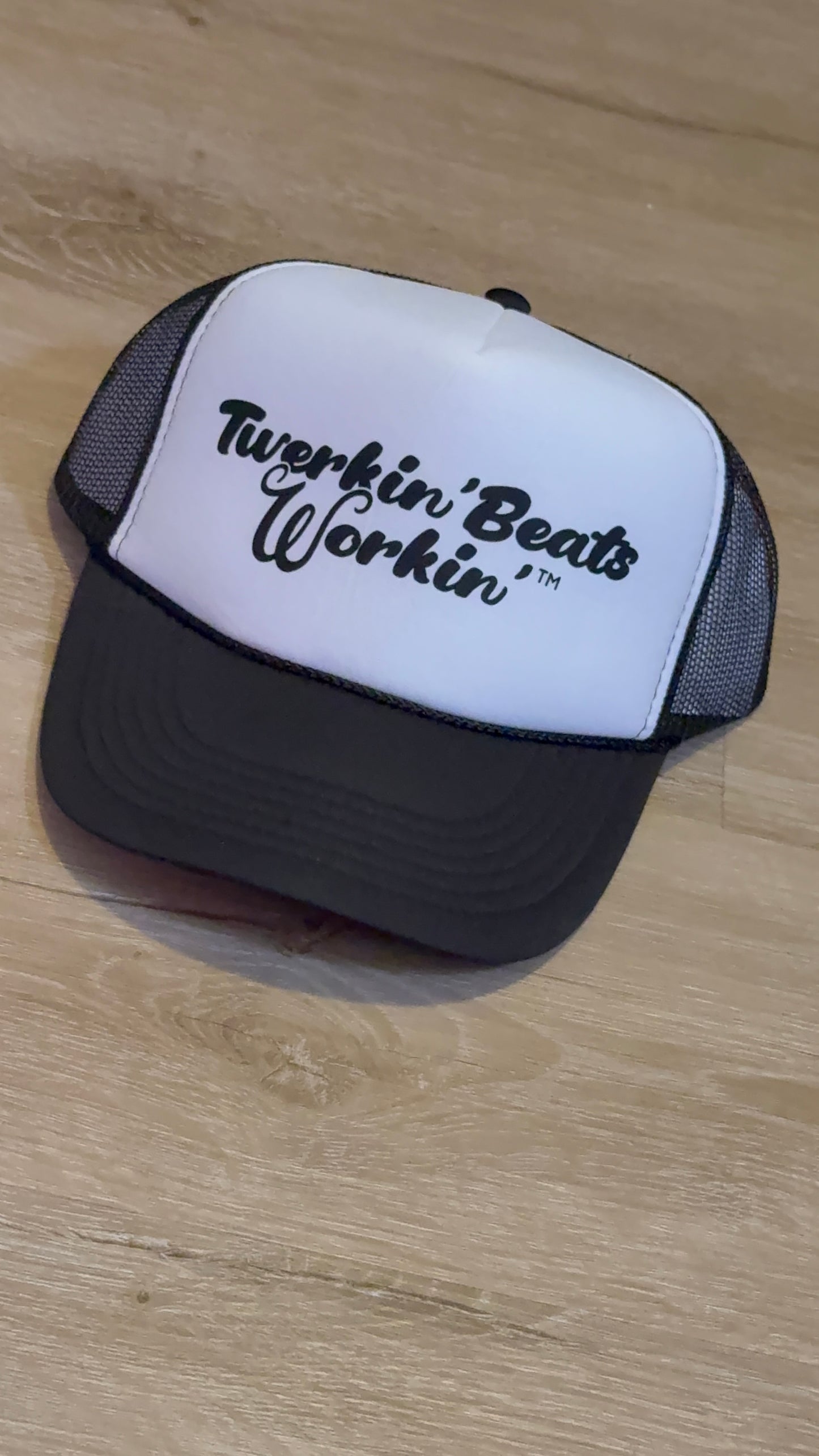 White and black hat with black Twerkin’ Beats Workin’ logo