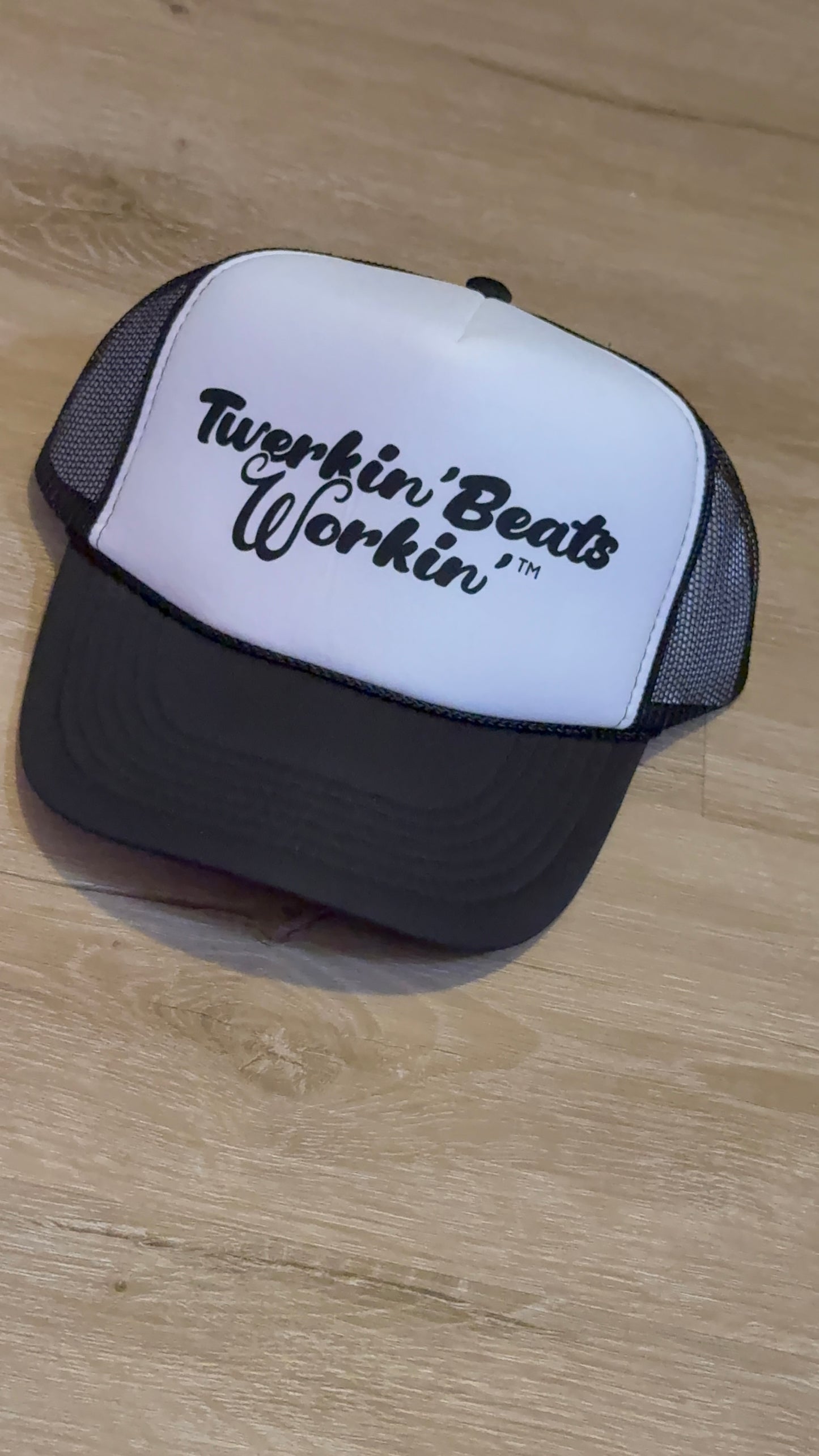 White and black hat with black Twerkin’ Beats Workin’ logo