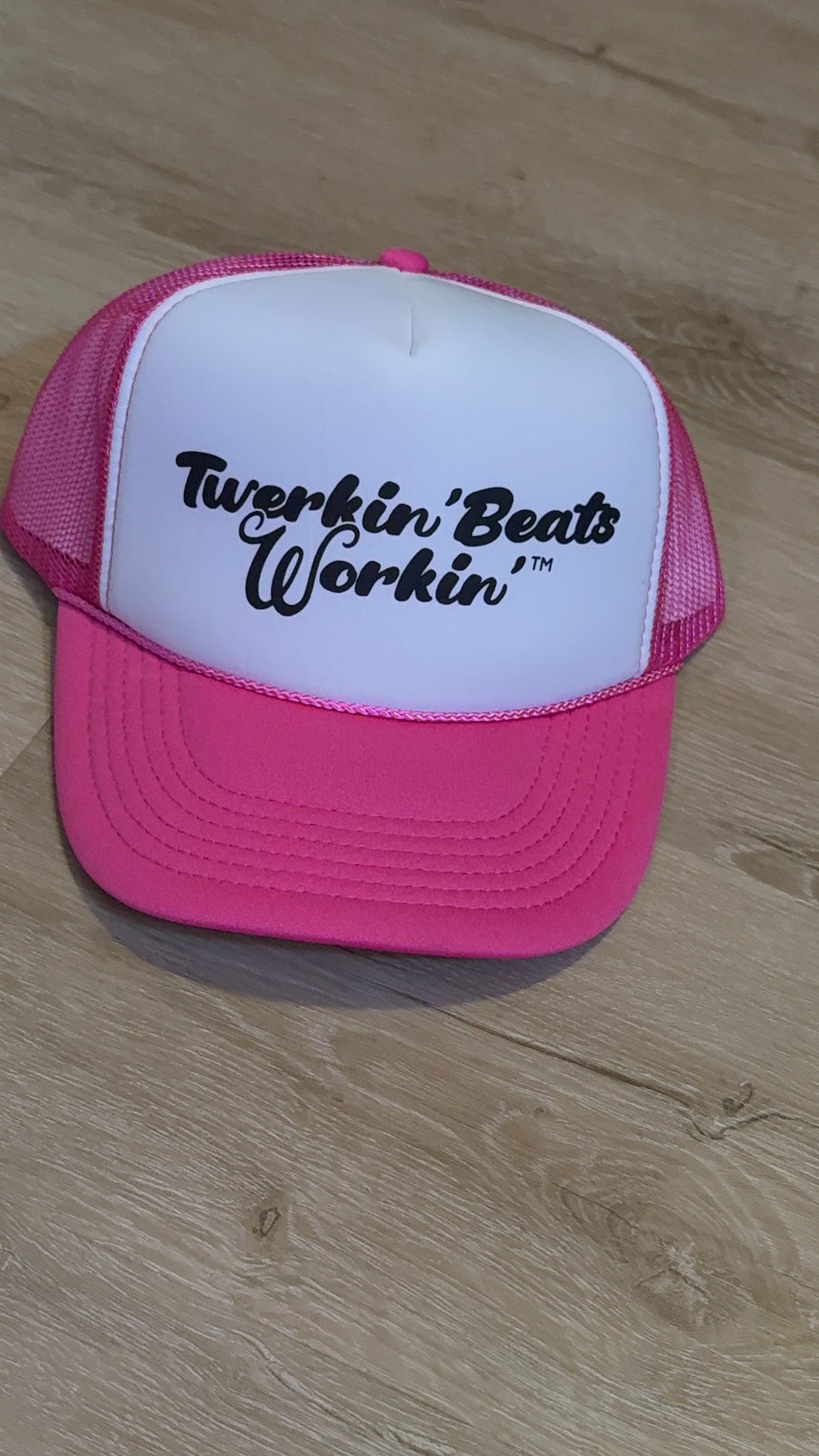 Pink and white with regular Twerkin’ Beats Workin’ in black logo